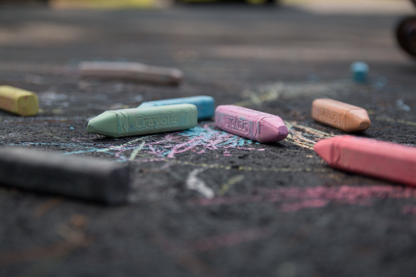 Large coloured pieces of chalk littering the pavement.